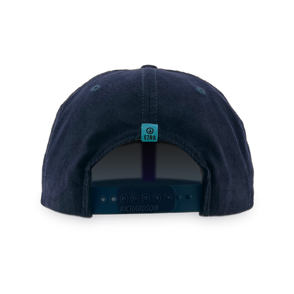 Back of navy blue corduroy cap with an EZRA logo label on the back against a white background