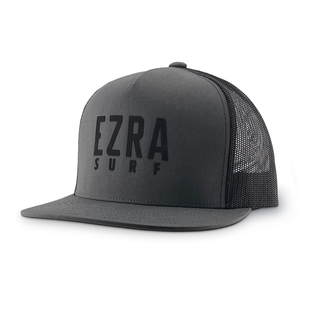 Black and gray trucker cap with 'EZRA SURF' text on a white background