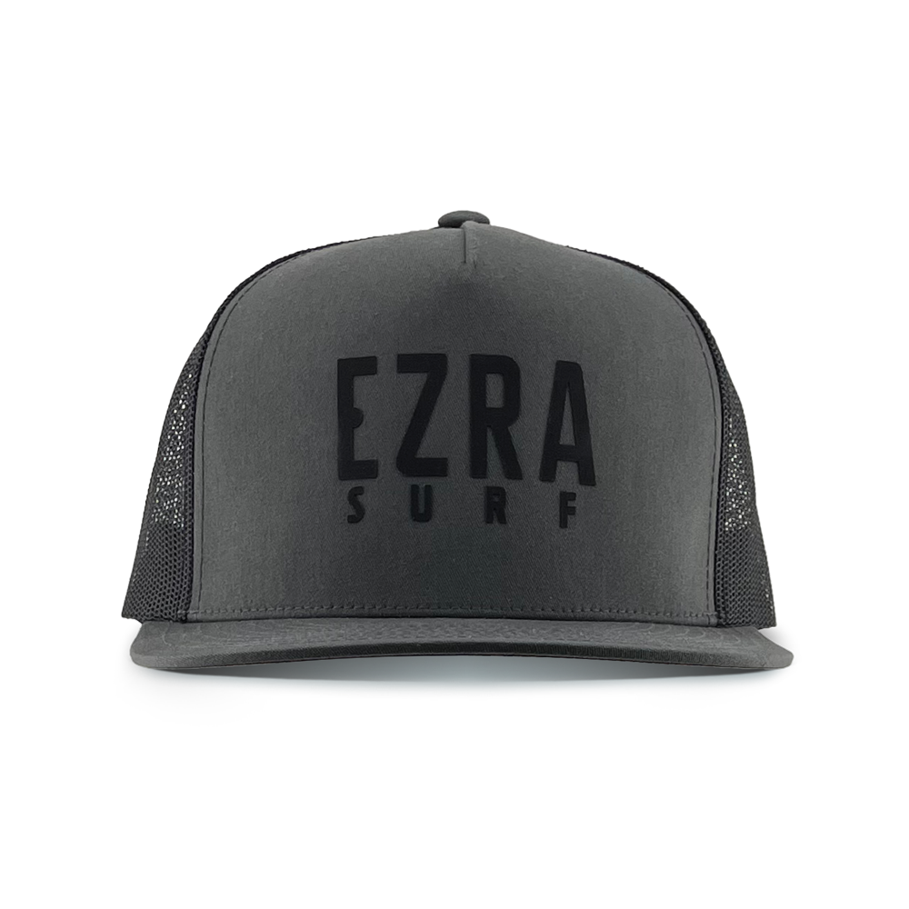 Black and dark gray cap with 'EZRA SURF' text on a white background