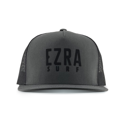 Black and dark gray cap with 'EZRA SURF' text on a white background