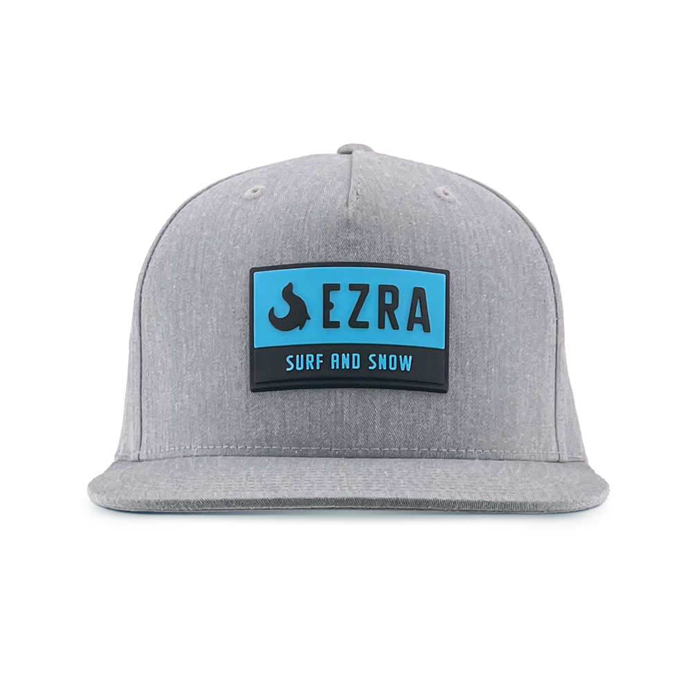 Gray cap with a blue and black 'EZRA Surf and Snow' logo on a white background
