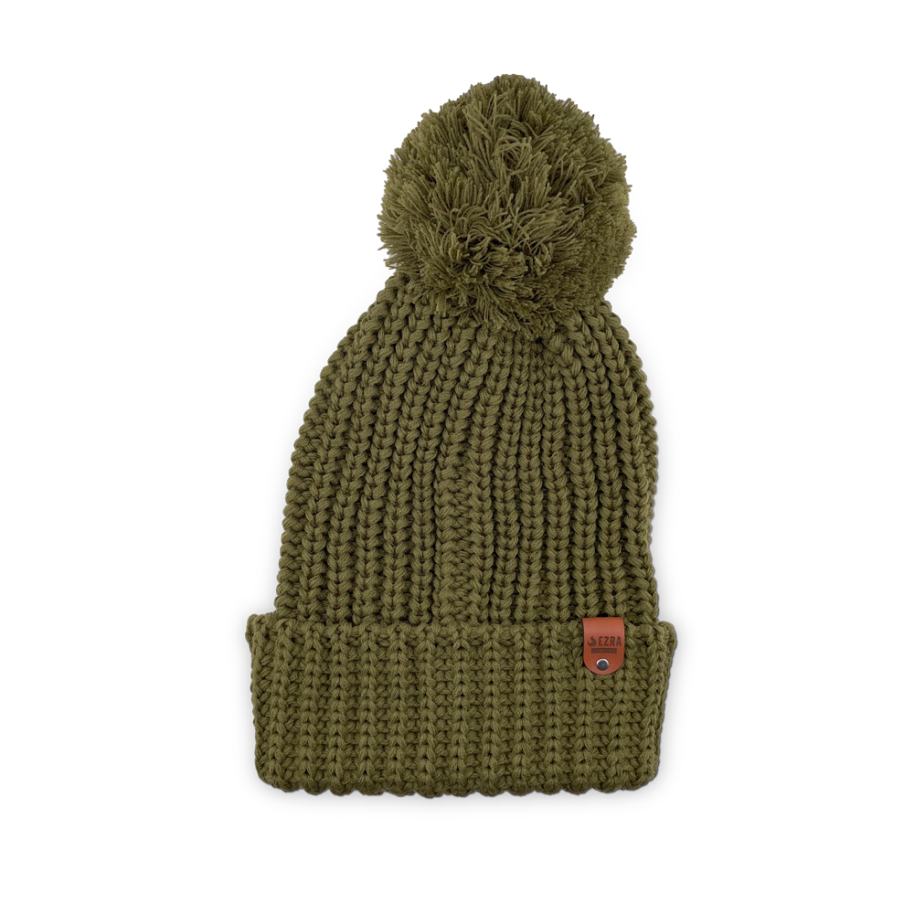 Avocado color knitted beanie toque with a pom-pom on a white background